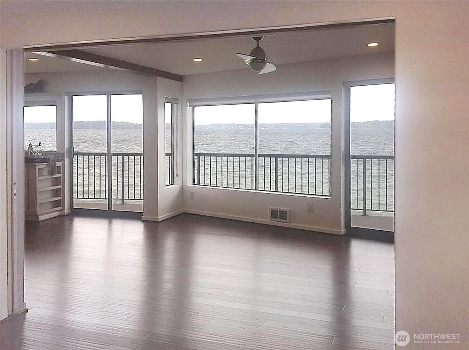 4131 Beach Drive Southwest Seattle, WA 98116 - Photo 14 of 40 a view of a room with wooden floor and balcony