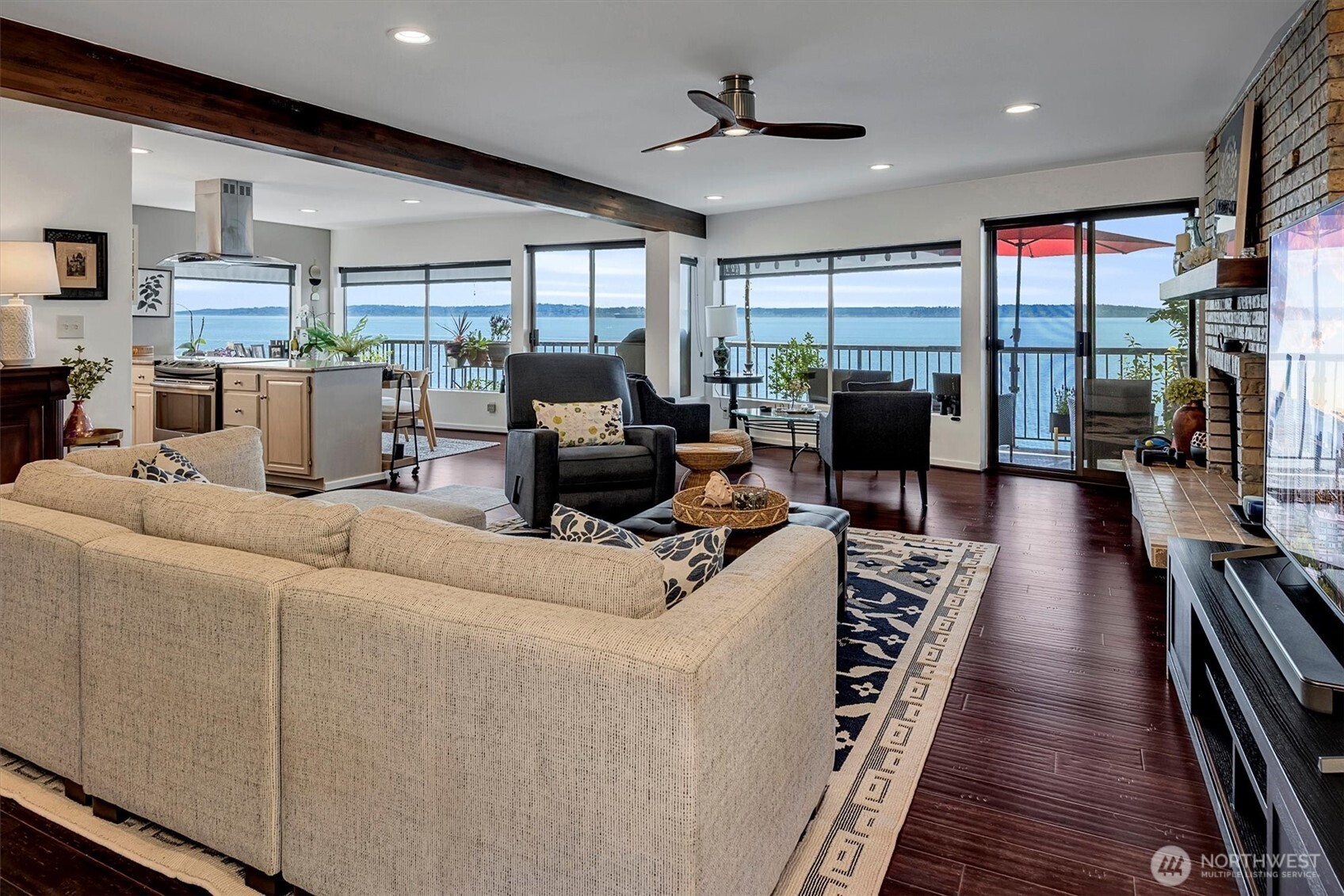 4131 Beach Drive Southwest Seattle, WA 98116 - Photo 19 of 40 a living room with furniture kitchen view and a large window