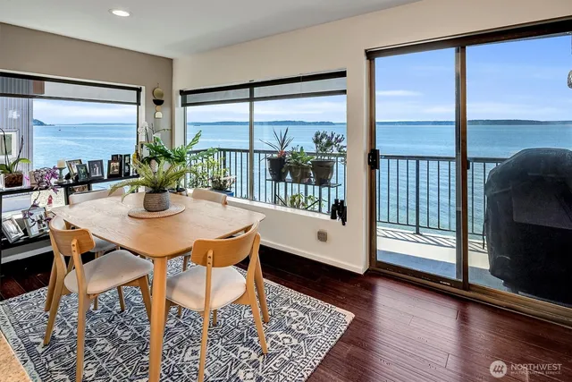 a kitchen with stainless steel appliances granite countertop a sink a stove and a wooden cabinets