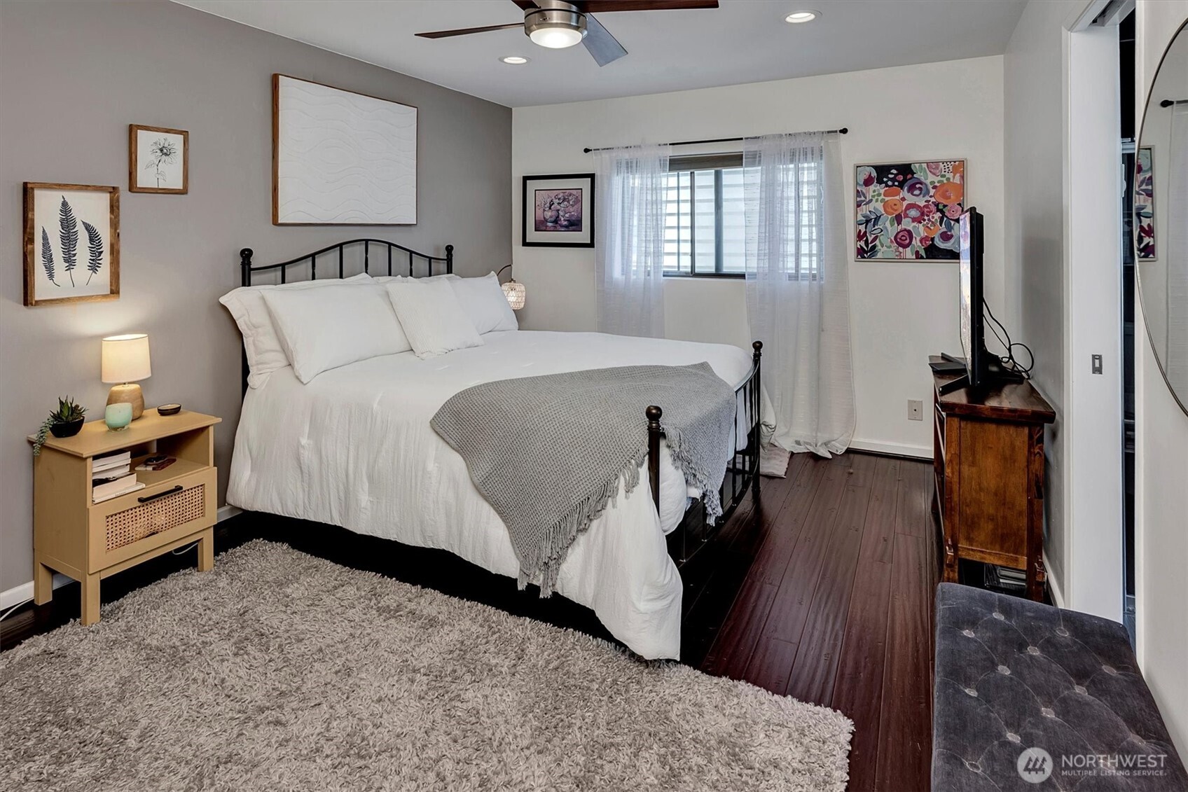 4131 Beach Drive Southwest Seattle, WA 98116 - Photo 26 of 40 a bed room with a bed and a television