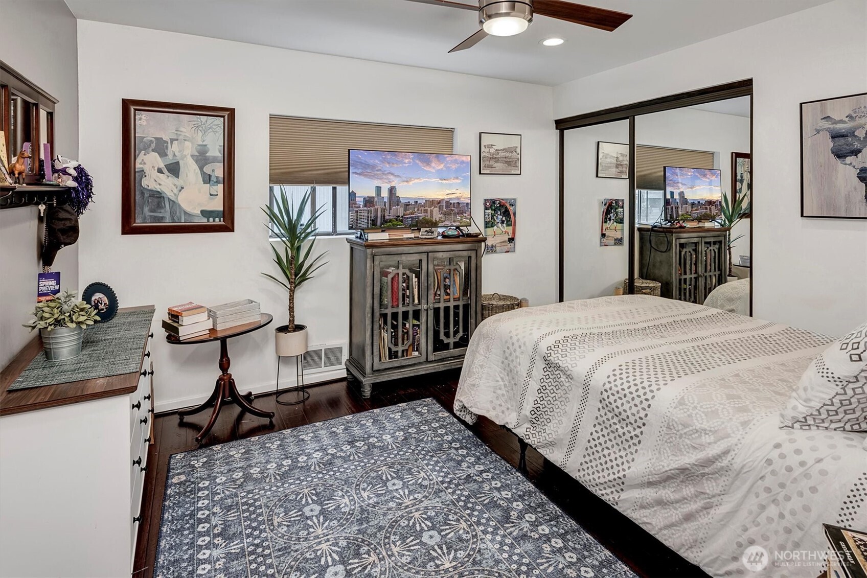 4131 Beach Drive Southwest Seattle, WA 98116 - Photo 29 of 40 a bedroom with a bed and wooden floor