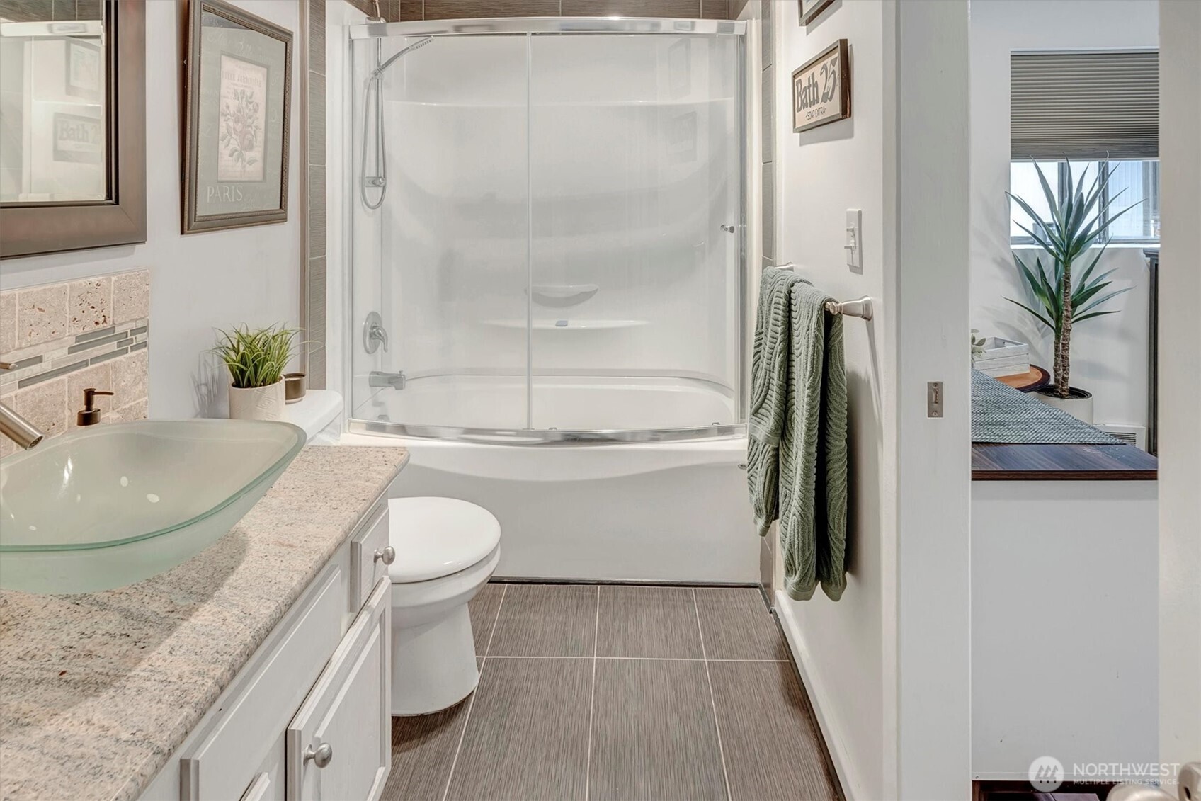 4131 Beach Drive Southwest Seattle, WA 98116 - Photo 30 of 40 a bathroom with a granite countertop sink toilet and shower