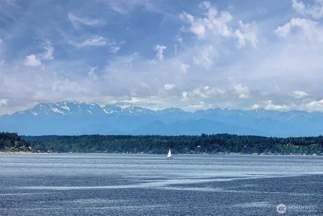 a very nice looking living room with furniture and floor to ceiling windows