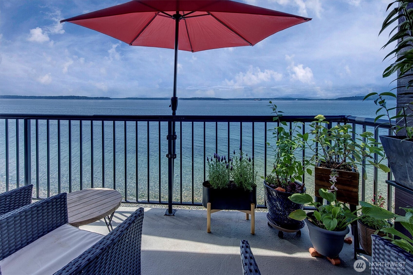 4131 Beach Drive Southwest Seattle, WA 98116 - Photo 31 of 40 a view of a patio with furniture and potted plants