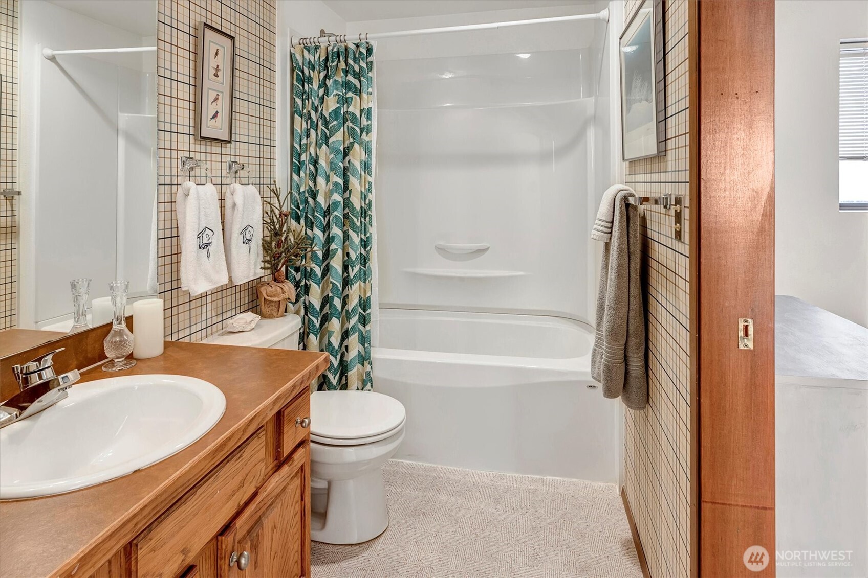 4131 Beach Drive Southwest Seattle, WA 98116 - Photo 37 of 40 a bathroom with a granite countertop sink toilet and shower