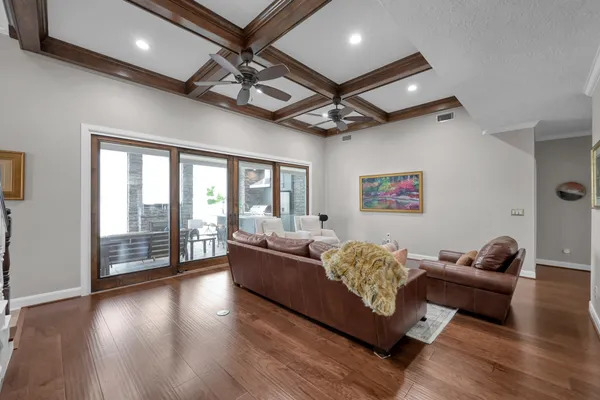 a kitchen with granite countertop stove sink and cabinets