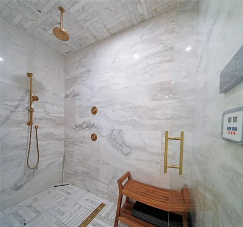 a spacious bedroom with a bed and a flat screen tv