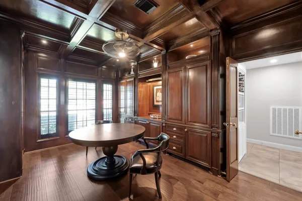 a living room with furniture ceiling fan and a rug