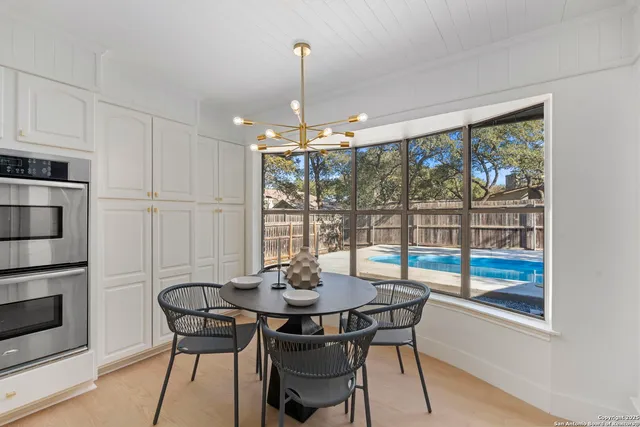 a view of a dining room with furniture window and outside view