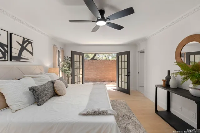 a bed room with a bed and a large window