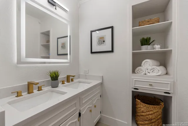 a bathroom with a sink and a mirror