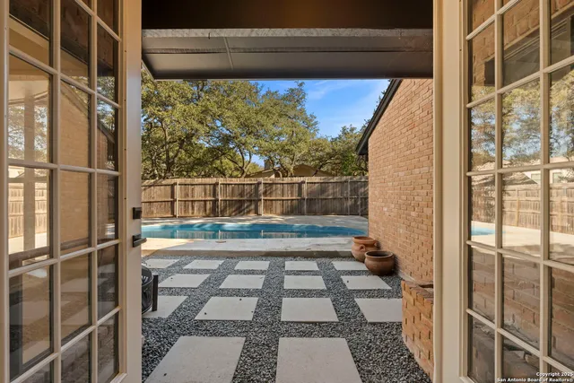 a view of a door and a window