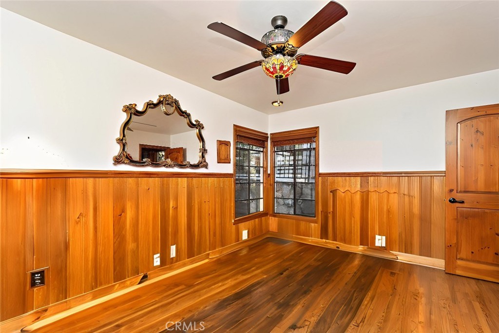 329 Summit Road Lake Arrowhead, CA 92352 - Photo 17 of 61 an empty room with wooden floor closet and windows