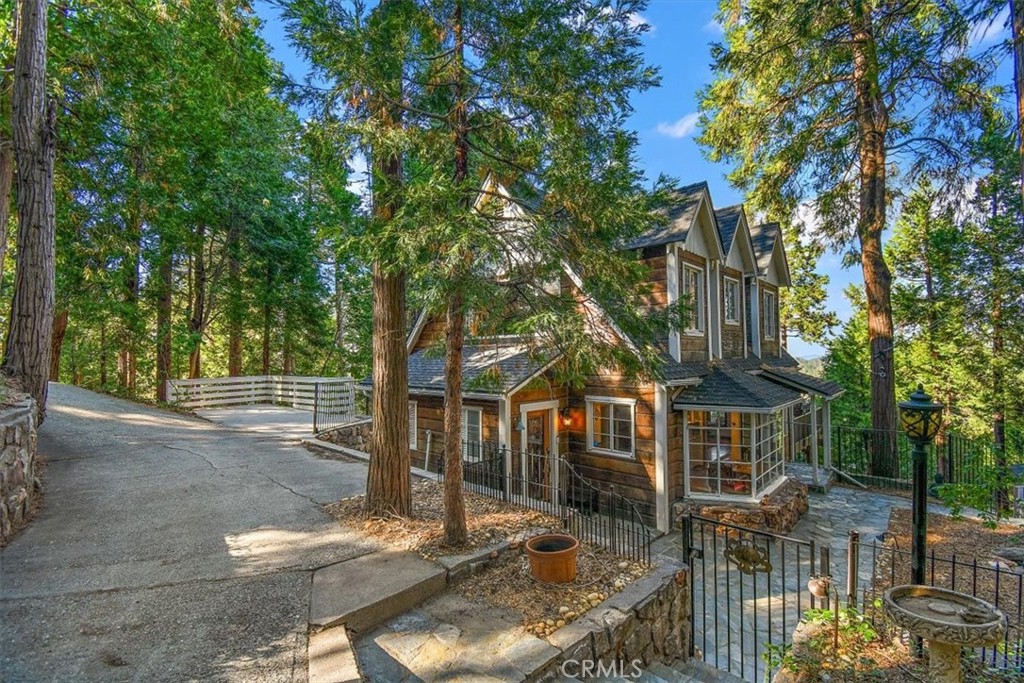 329 Summit Road Lake Arrowhead, CA 92352 - Photo 33 of 61 a front view of a house with a tree