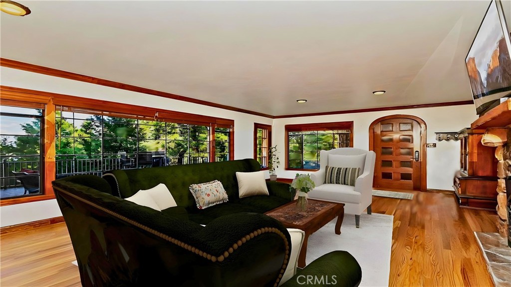 329 Summit Road Lake Arrowhead, CA 92352 - Photo 4 of 61 a living room with furniture and a large window