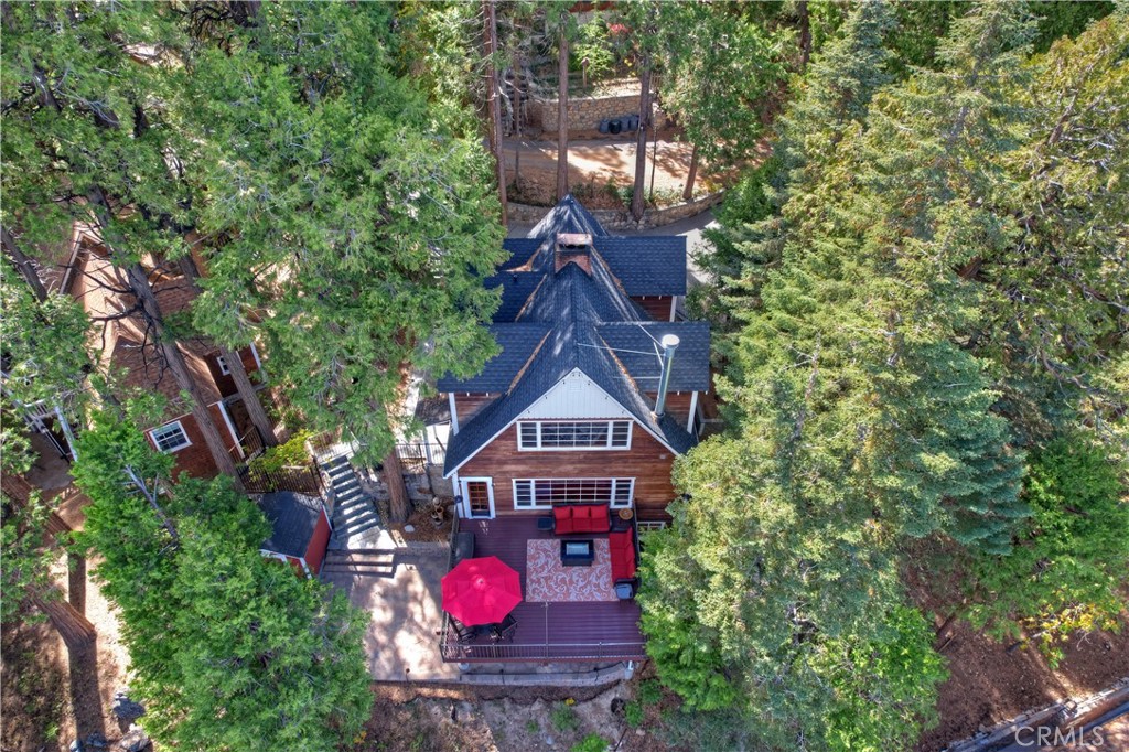 329 Summit Road Lake Arrowhead, CA 92352 - Photo 57 of 61 a red brick house with a small yard and a large tree