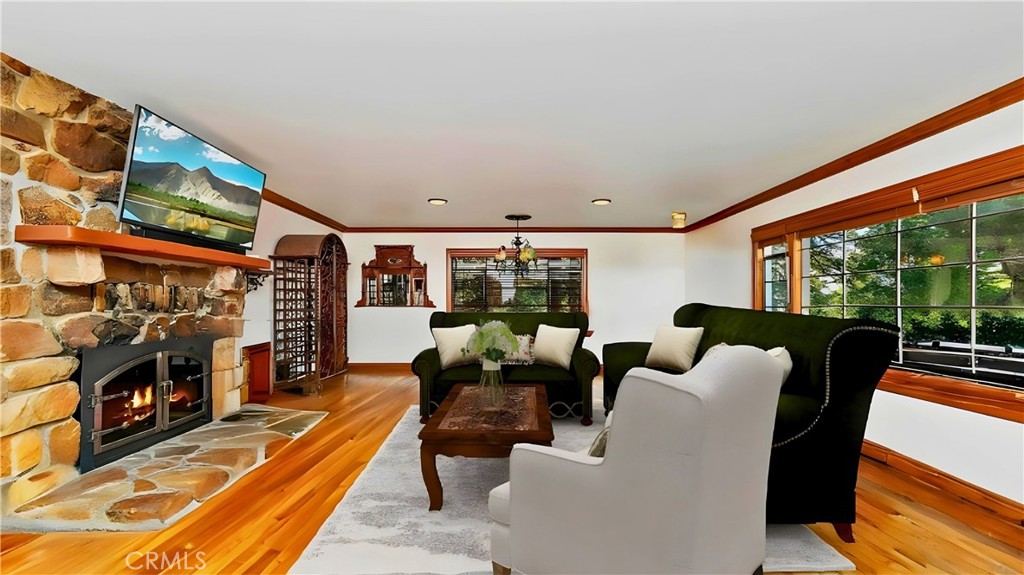 329 Summit Road Lake Arrowhead, CA 92352 - Photo 7 of 61 a living room with furniture and a flat screen tv