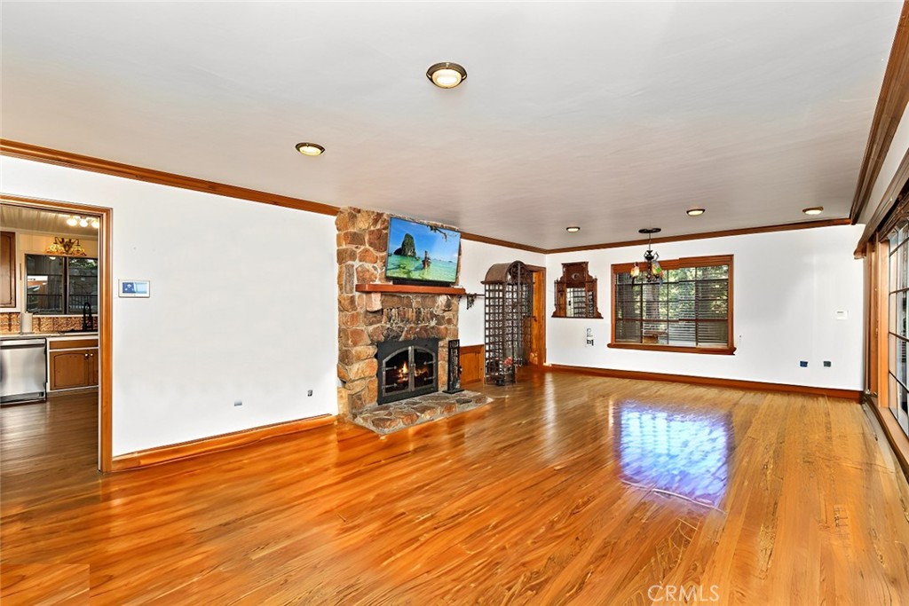 329 Summit Road Lake Arrowhead, CA 92352 - Photo 10 of 61 a view of an empty room with window and wooden floor