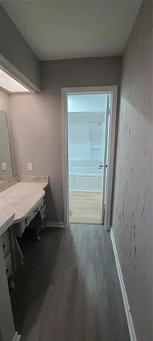 a room with a wooden floor and furniture