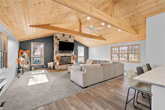 a living room with furniture and flat screen tv