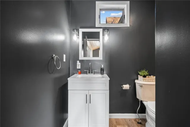 a bathroom with a sink vanity and mirror