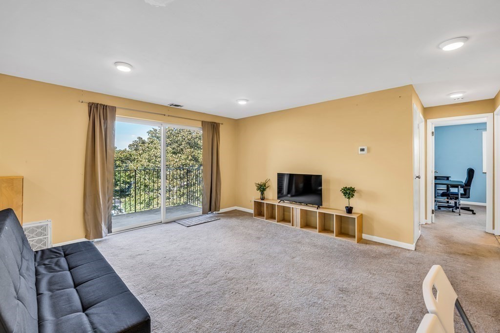 175 Clare Avenue, Unit E8 Boston, MA 02136 - Photo 2 of 16 a view of livingroom with furniture and workspace