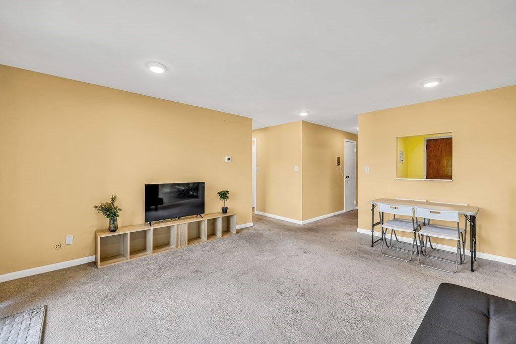 175 Clare Avenue, Unit E8 Boston, MA 02136 - Photo 3 of 16 a view of livingroom with furniture