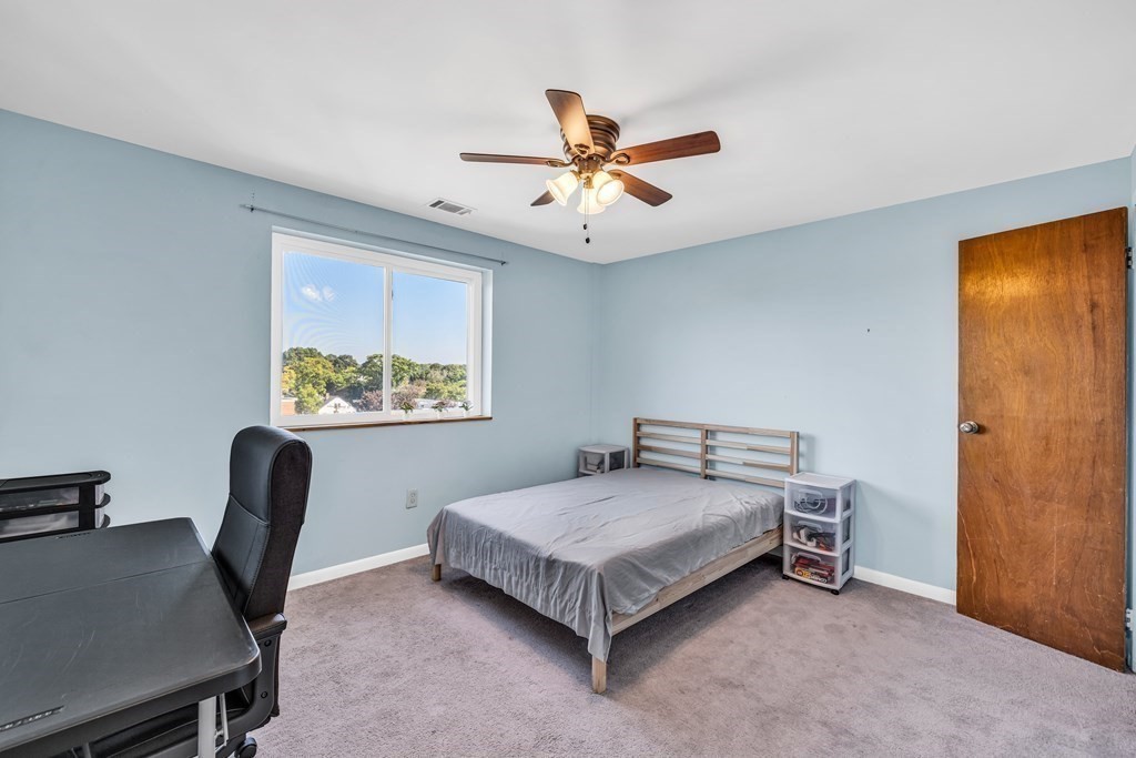 175 Clare Avenue, Unit E8 Boston, MA 02136 - Photo 7 of 16 a bedroom with a bed and a window