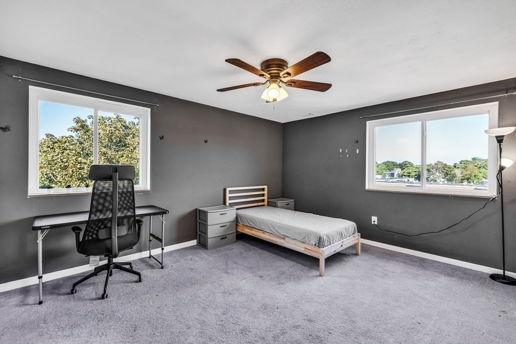 175 Clare Avenue, Unit E8 Boston, MA 02136 - Photo 9 of 16 a bedroom with a bed and a window