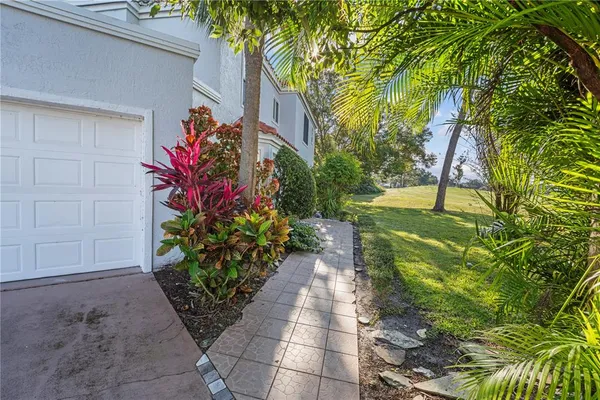 a view of a pathway with a yard