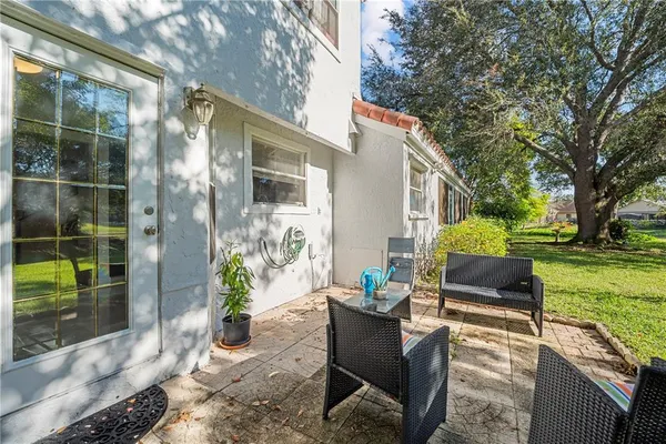 a view of backyard with seating area and green space