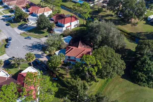 an aerial view of house with yard