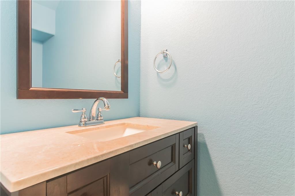252 Pond View Pass Buda, TX 78610 - Photo 25 of 37 Bathroom featuring vanity and a textured wall