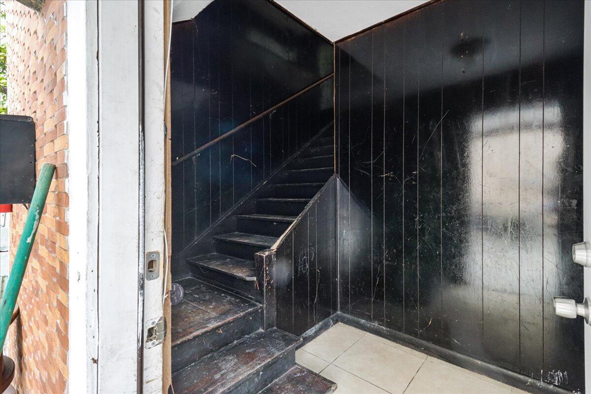 29 Southwest 9th Avenue Miami, FL 33130 - Photo 21 of 22 a view of staircase with white walls and a mirror