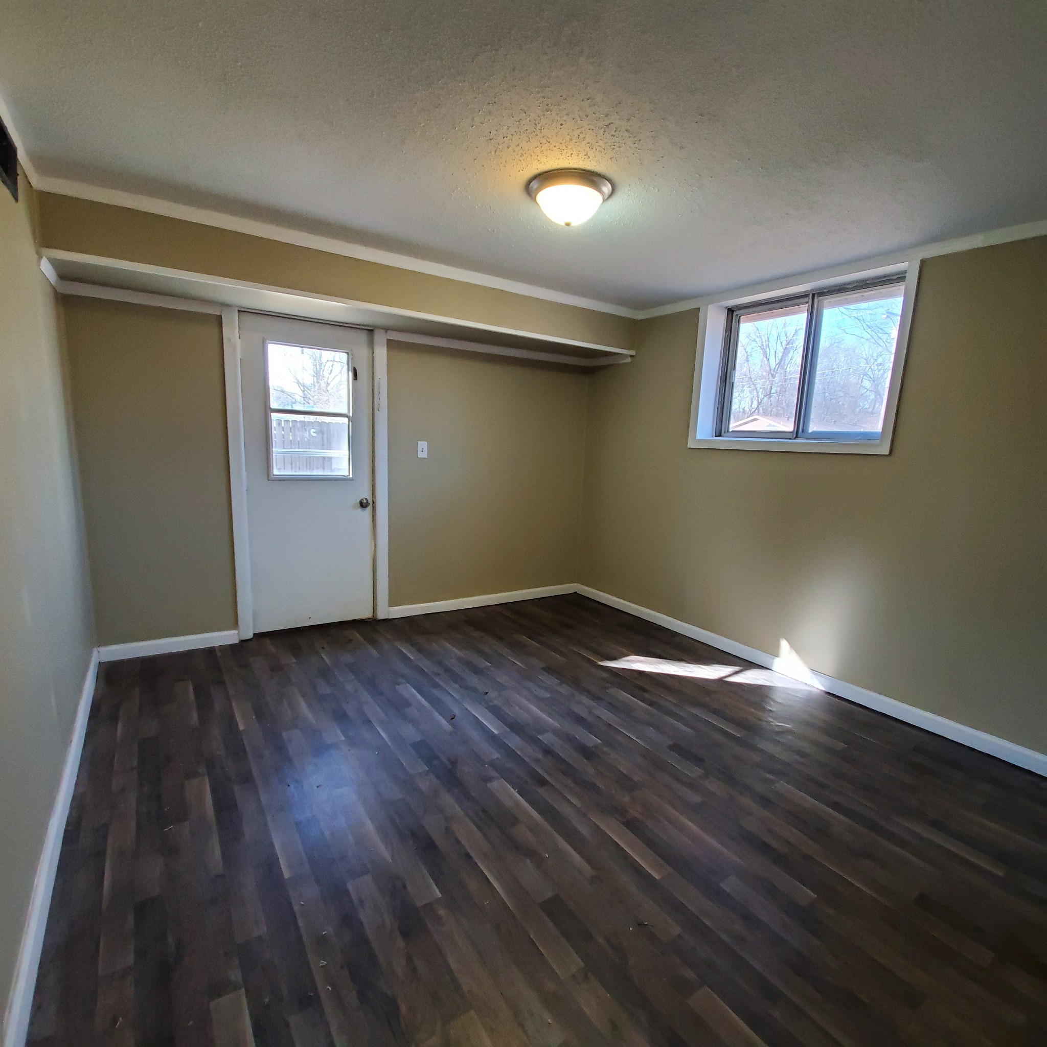 108 Airport Road Clarksville, TN 37042 - Photo 13 of 16 a view of empty room with wooden floor and fan