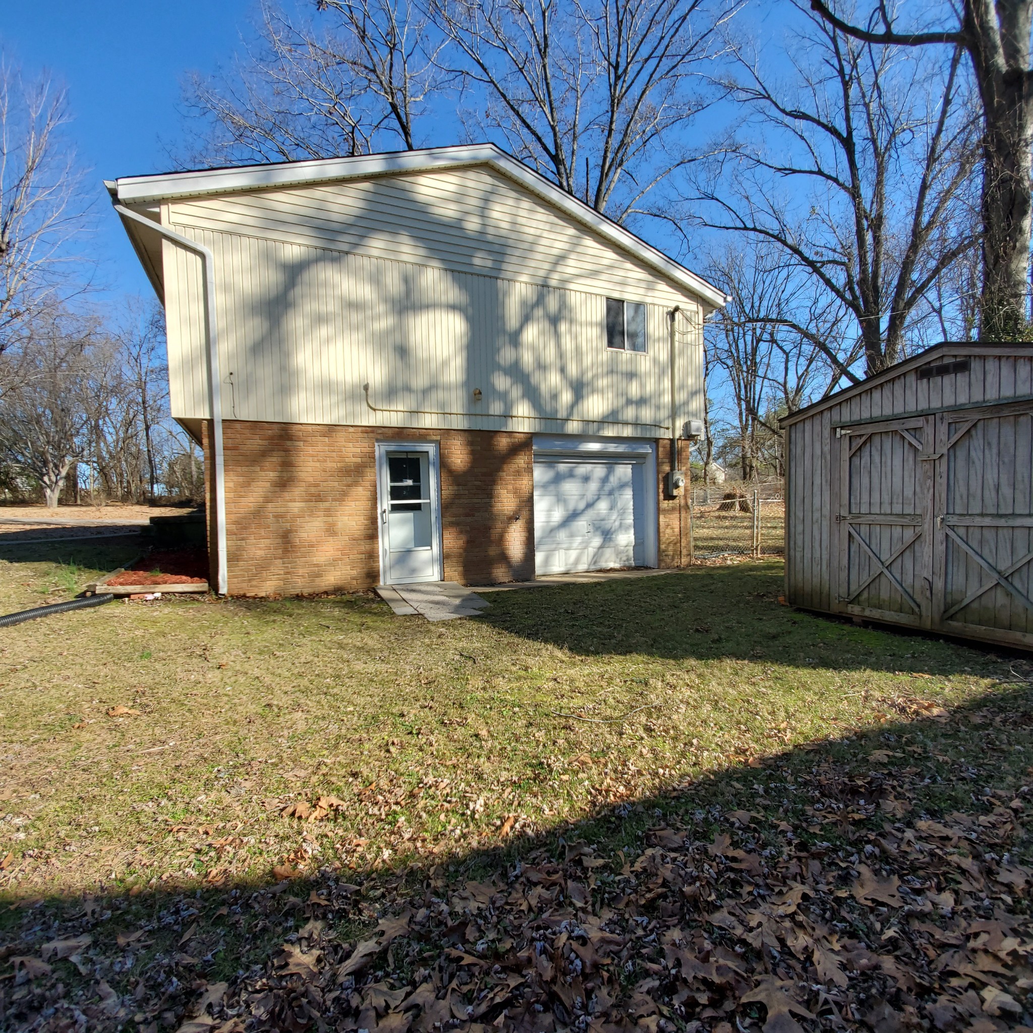 108 Airport Road Clarksville, TN 37042 - Photo 16 of 16 a view of a house with a yard