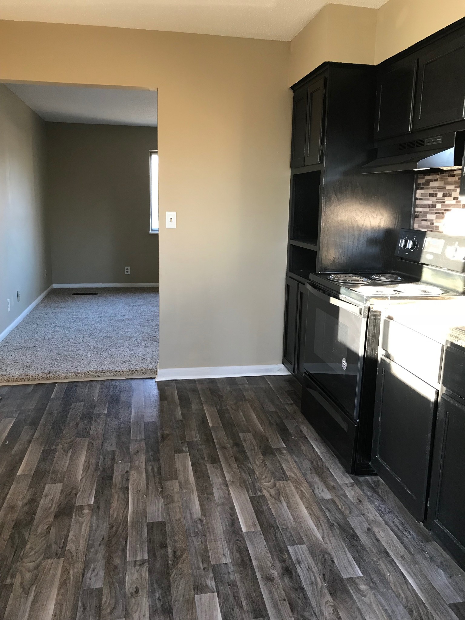 108 Airport Road Clarksville, TN 37042 - Photo 6 of 16 a kitchen with a refrigerator and a stove