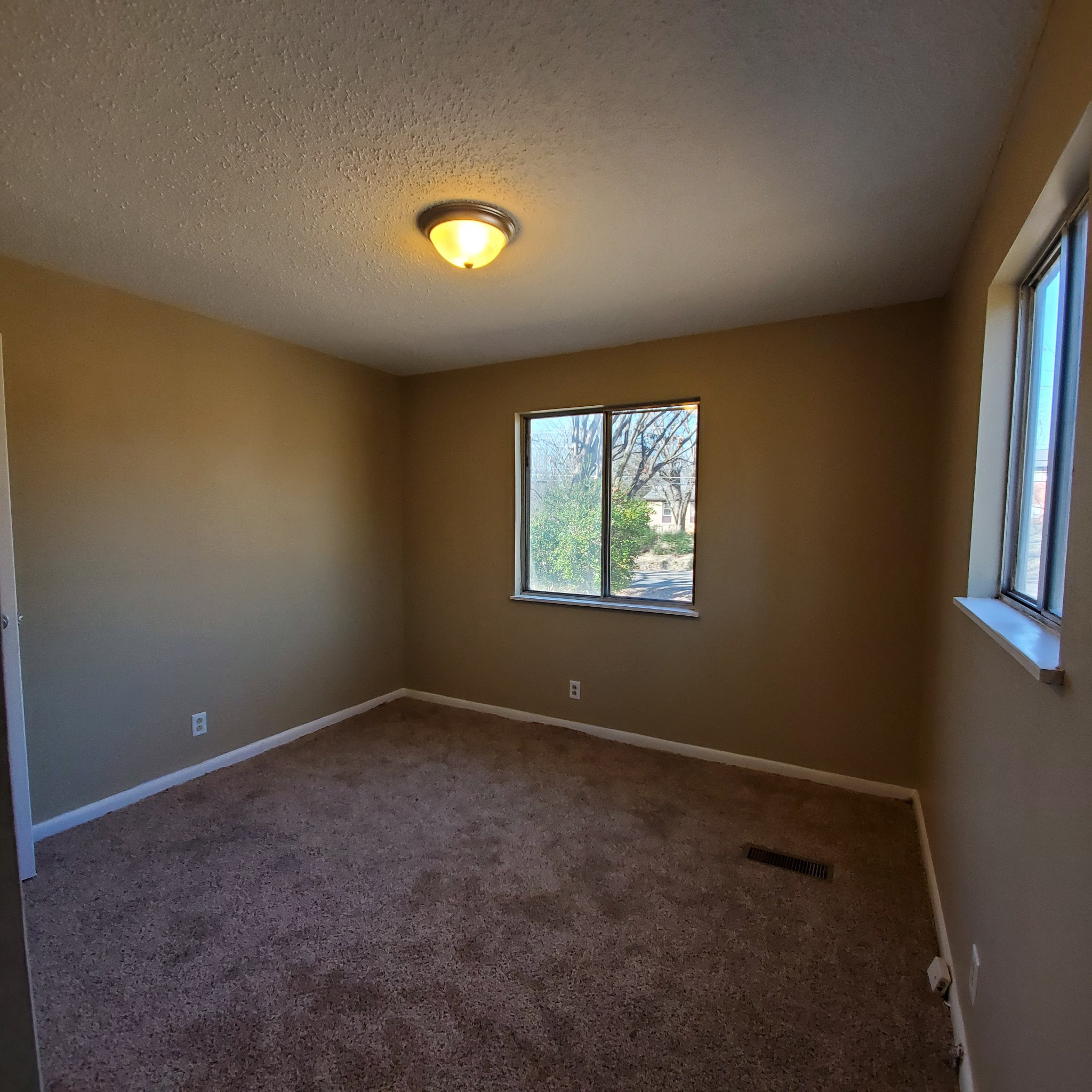 108 Airport Road Clarksville, TN 37042 - Photo 7 of 16 an empty room with windows