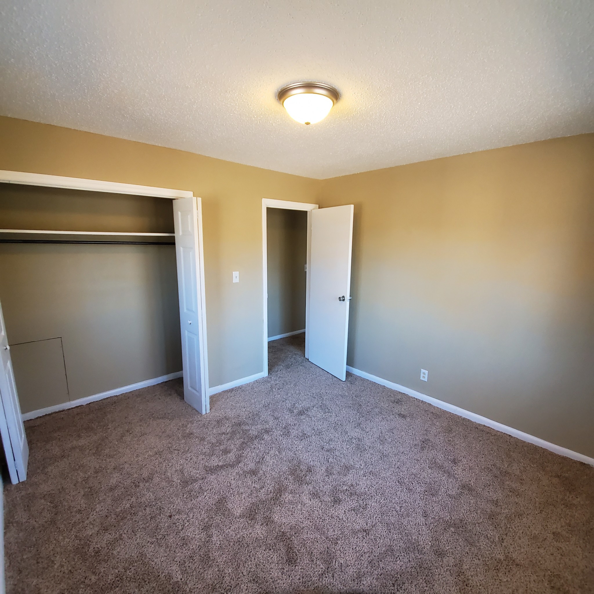 108 Airport Road Clarksville, TN 37042 - Photo 8 of 16 a view of an empty room with closet and wooden floor