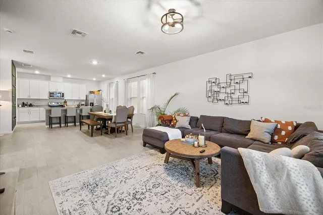 a living room with furniture and a table