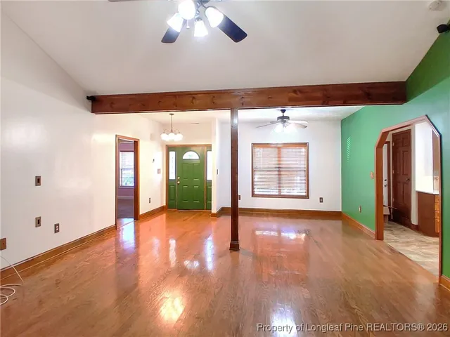 a kitchen with stainless steel appliances granite countertop a refrigerator a sink and a stove