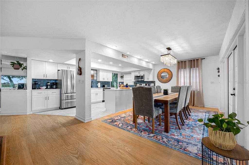 2153 Karan Way Clearwater, FL 33763 - Photo 13 of 65 a view of a dining room with furniture window and wooden floor