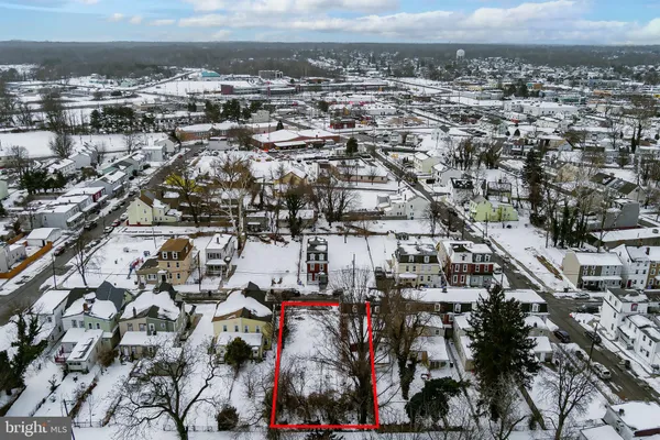 an aerial view of residential building and parking space