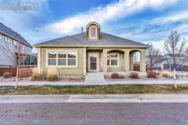 a front view of house with outdoor space