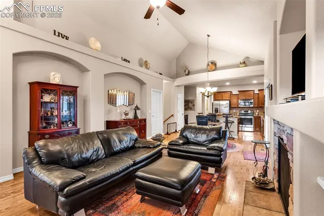 a living room with furniture fireplace and flat screen tv