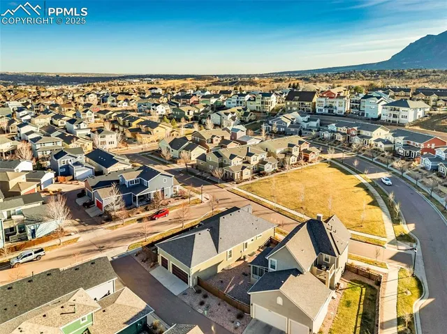 an aerial view of residential houses with outdoor space