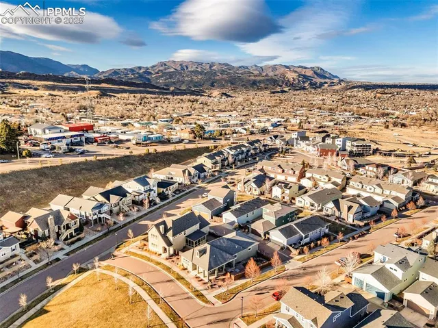 an aerial view of residential building and ocean