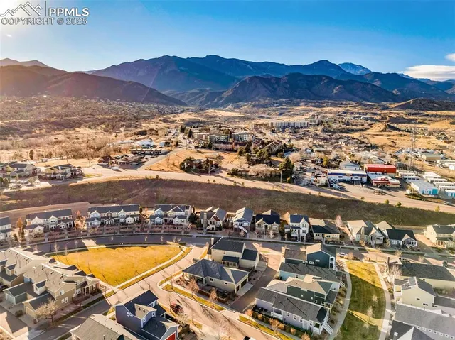 an aerial view of residential houses and outdoor space