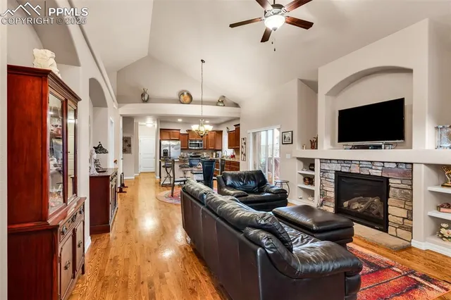 a living room with furniture fireplace and flat screen tv