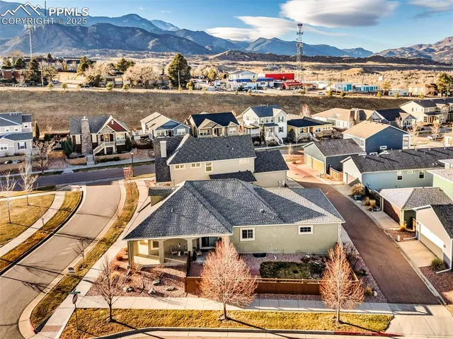 an aerial view of residential houses with outdoor space